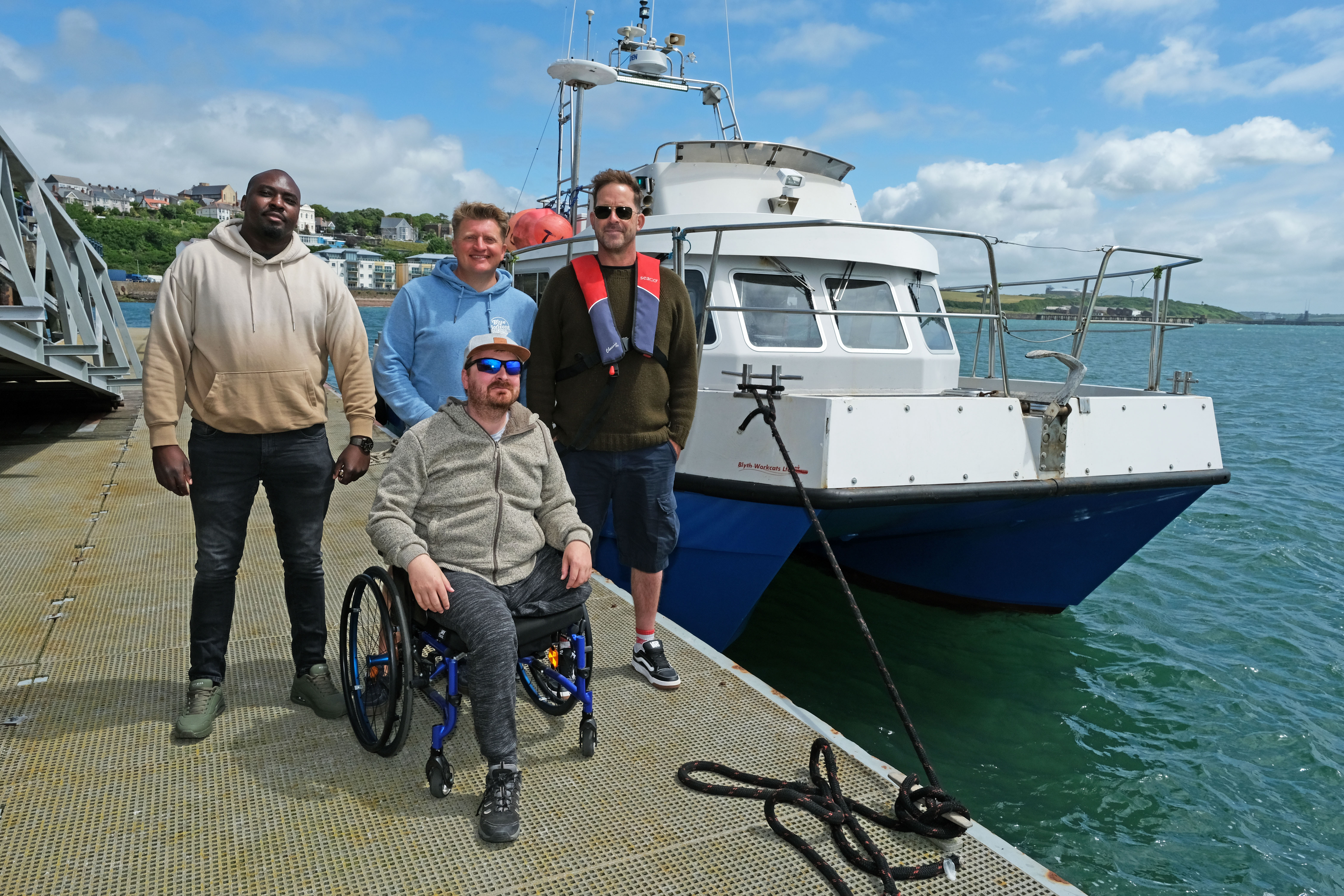 members-of-the-vc-gallery-prepare-to-enjoy-a-boat-trip-with-oliver-bird-from-blue-horizons-surf-school-centre-and-coxswain-at-the-port-of-milford-haven-graham-howells-right.jpg