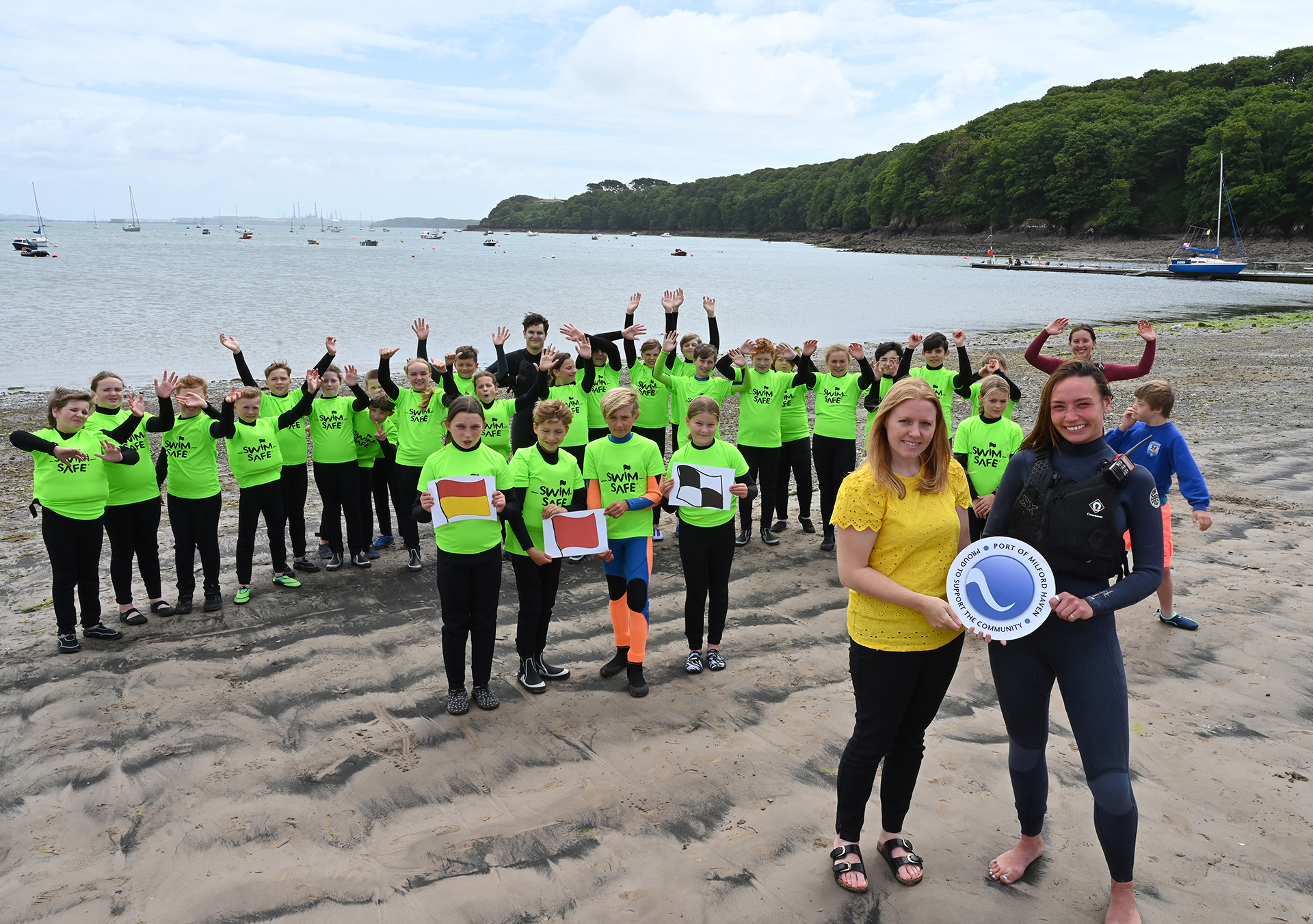 sara-richards-from-the-port-of-milford-haven-and-miyah-periam-senior-instructor-at-windswept-with-year-6-pupils-from-cleddau-reach-school-at-dale-beach.jpg